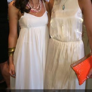 White maxi dress. Open back and tie detail.